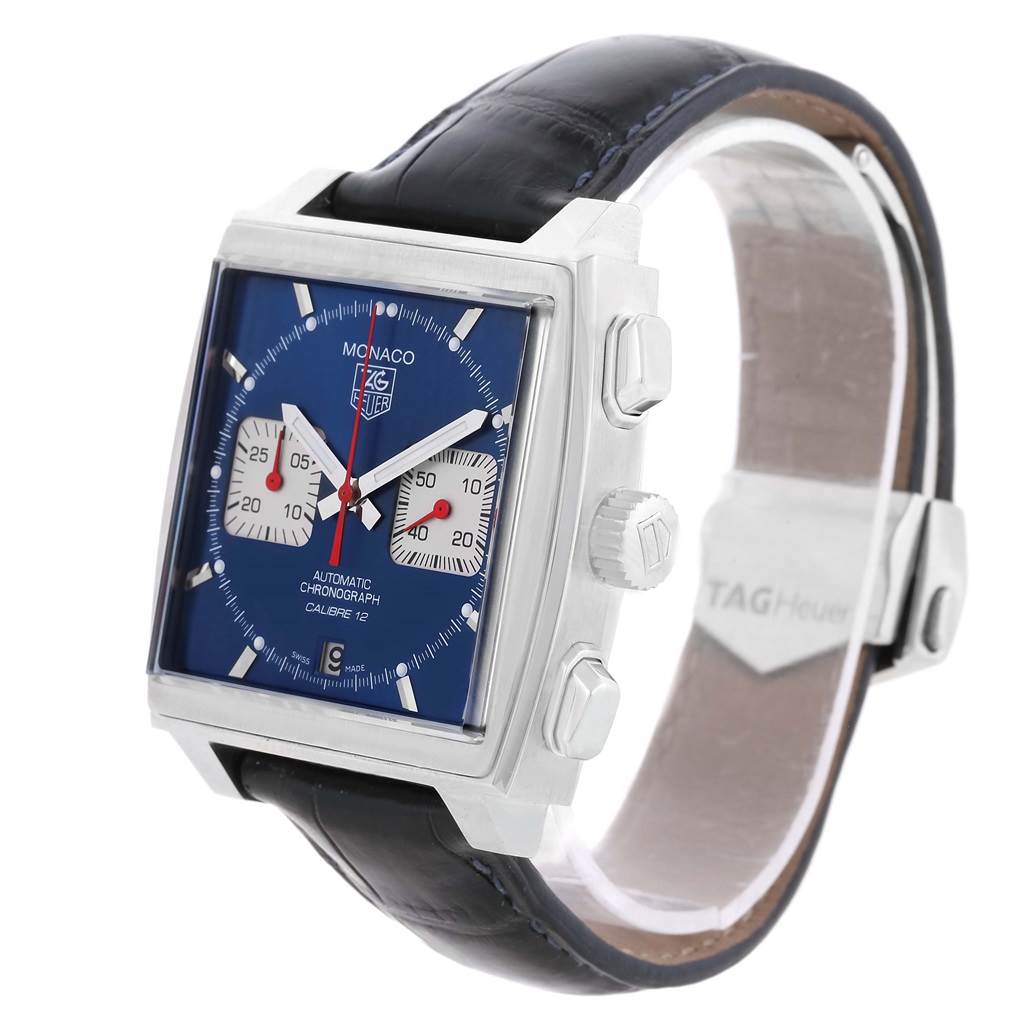 The image shows a Tag Heuer Monaco CAW2111 Men's Stainless Steel Blue Dial CAW2111 Men's Stainless Steel Blue Dial watch at a three-quarter angle, highlighting its blue dial, side buttons, and leather strap.