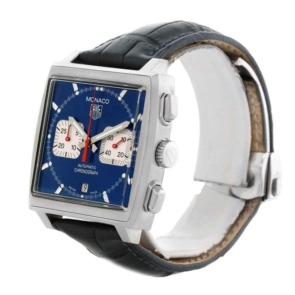 The Tag Heuer Monaco CW2113 Men's Stainless Steel Blue Dial CW2113 Men's Stainless Steel Blue Dial watch is shown from an oblique angle, displaying its blue dial, square case, chronograph buttons, and leather strap.