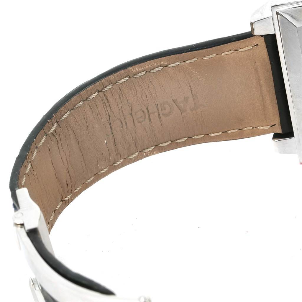 The image shows a close-up angle of the leather strap and part of the metal case of a Tag Heuer Monaco CW2113 Men's Stainless Steel Blue Dial CW2113 Men's Stainless Steel Blue Dial watch.