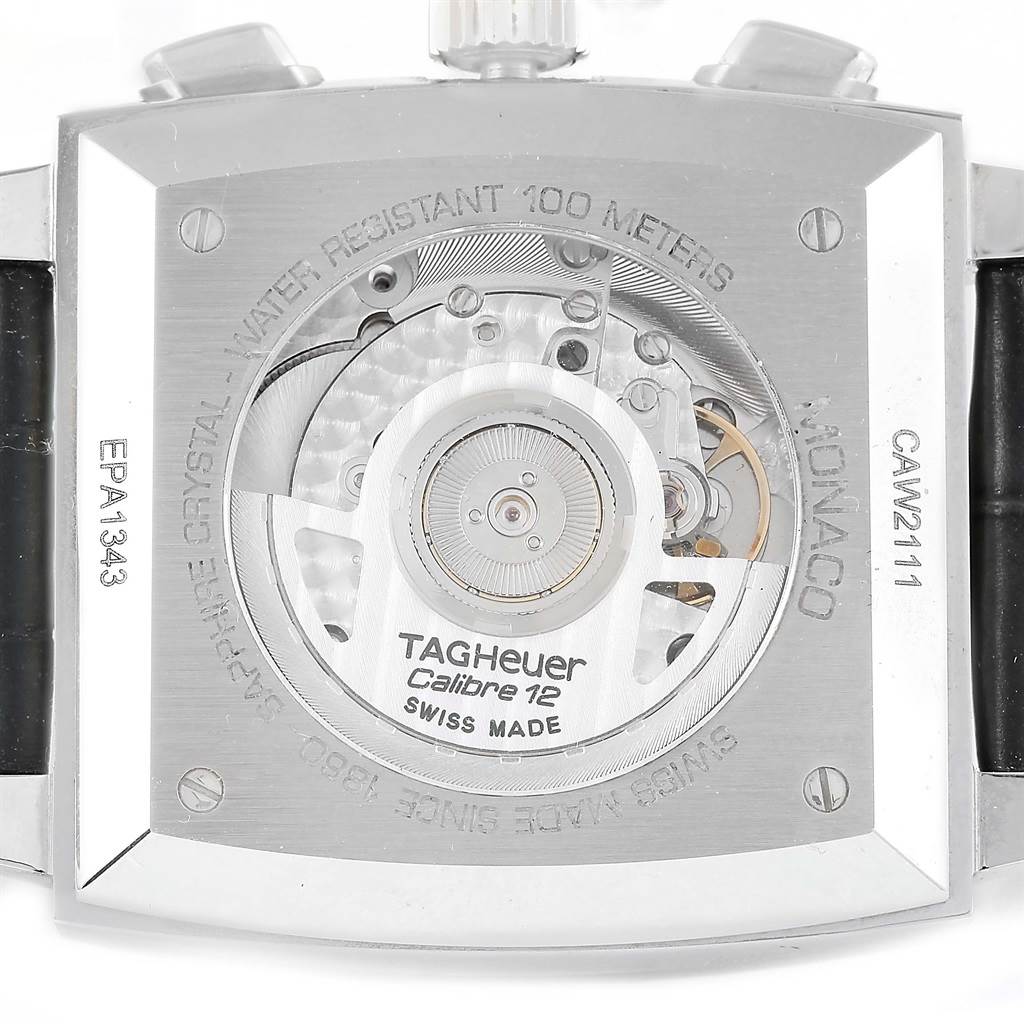 The image shows the back of a Tag Heuer Monaco CAW2111 Men's Stainless Steel Blue Dial CAW2111 Men's Stainless Steel Blue Dial watch, featuring its movement and engraved details.