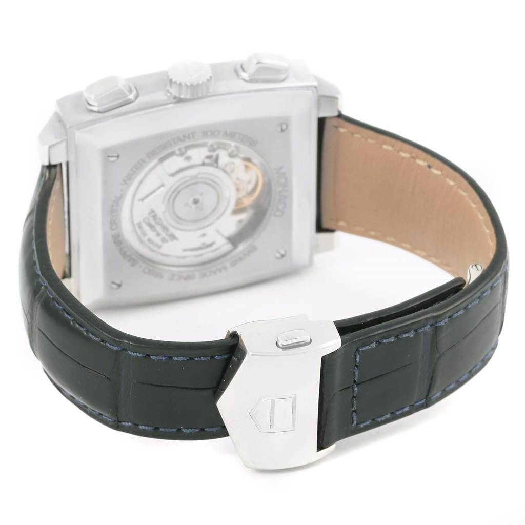 The image shows the back of a Tag Heuer Monaco CAW2111 Men's Stainless Steel Blue Dial CAW2111 Men's Stainless Steel Blue Dial watch, highlighting the clasp, strap, and case back with its mechanism visible.