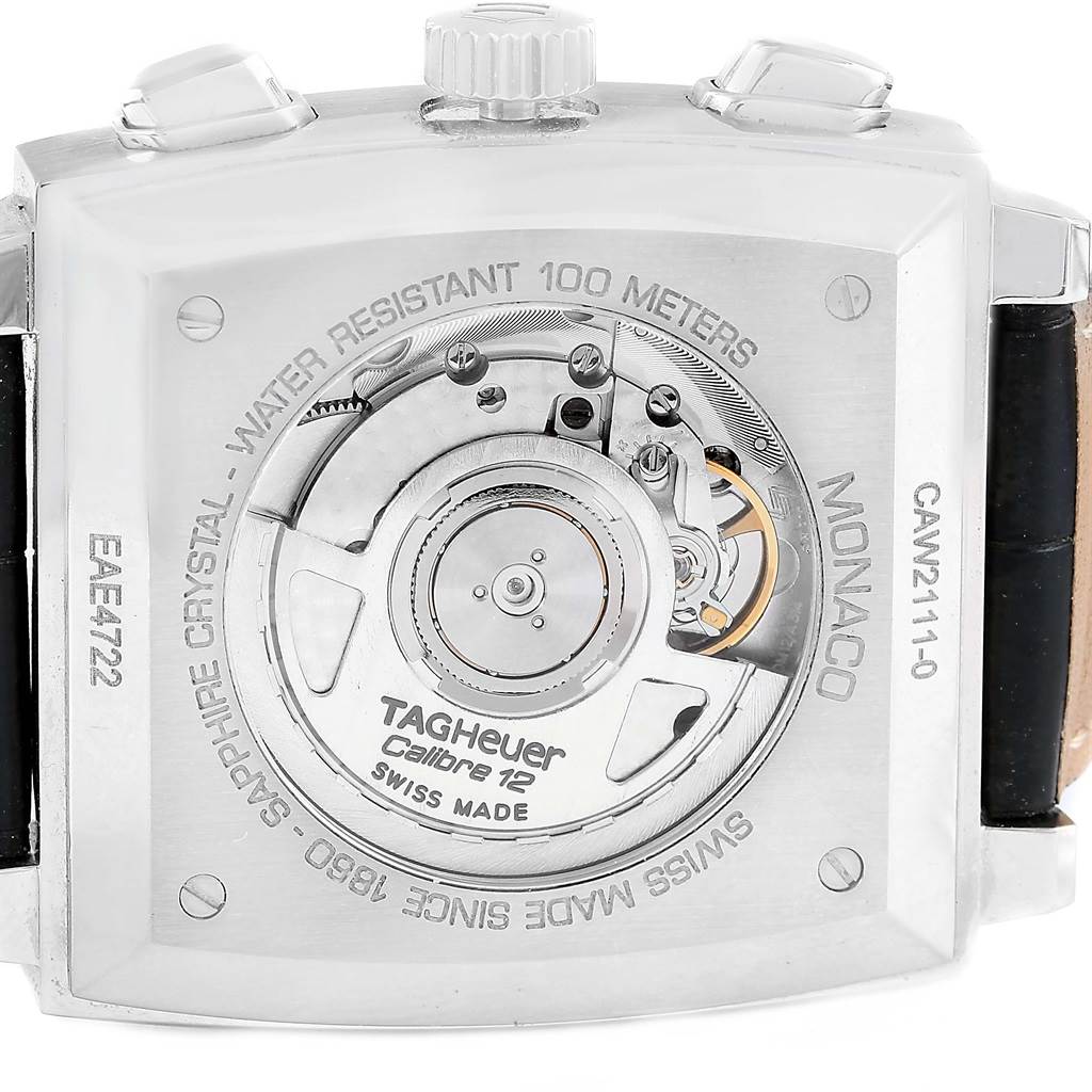 The image shows the back of a Tag Heuer Monaco CAW2111 Men
s Stainless Steel Blue Dial CAW2111 Men
s Stainless Steel Blue Dial watch, highlighting its movement and specifications.