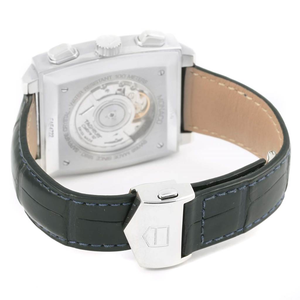 This is a rear view of the Tag Heuer Monaco CAW2111 Men
s Stainless Steel Blue Dial CAW2111 Men
s Stainless Steel Blue Dial watch showcasing its movement and black leather strap with a clasp.