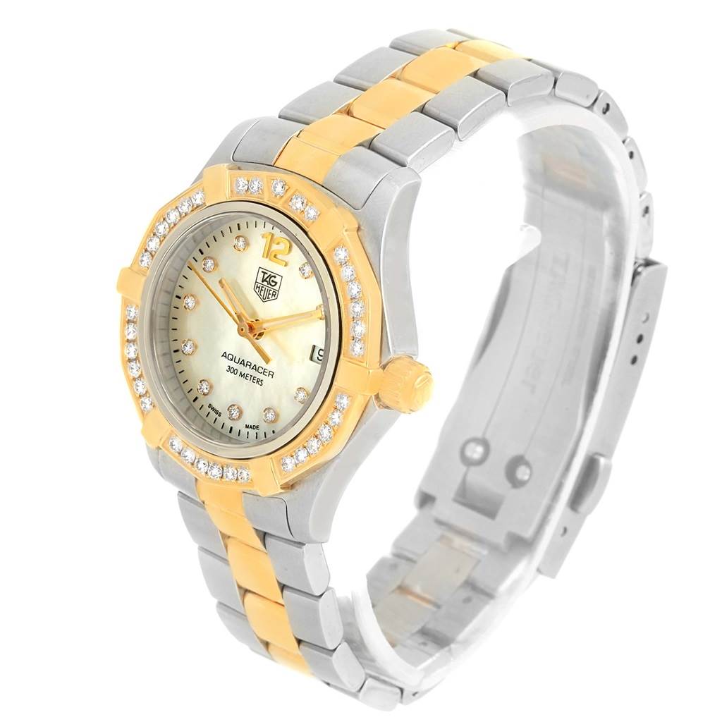 The image shows a Tag Heuer Aquaracer WAF1450.BA0825 Women
s Steel and Gold (two tone) Mother of Pearl Dial WAF1450.BA0825 Women
s Steel and Gold (two tone) Mother of Pearl Dial watch from an angled top perspective, highlighting the bezel, dial, and part of the band.