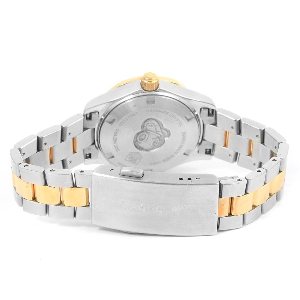 This image shows the backside of a Tag Heuer Aquaracer WAF1450.BA0825 Women
s Steel and Gold (two tone) Mother of Pearl Dial WAF1450.BA0825 Women
s Steel and Gold (two tone) Mother of Pearl Dial watch, highlighting the case back and part of the two-toned bracelet.
