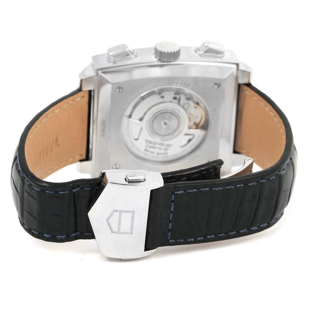 The image shows the back view of the Tag Heuer Monaco CAW2111 Men's Stainless Steel Blue Dial CAW2111 Men's Stainless Steel Blue Dial watch, highlighting the movement and black leather strap with a clasp.
