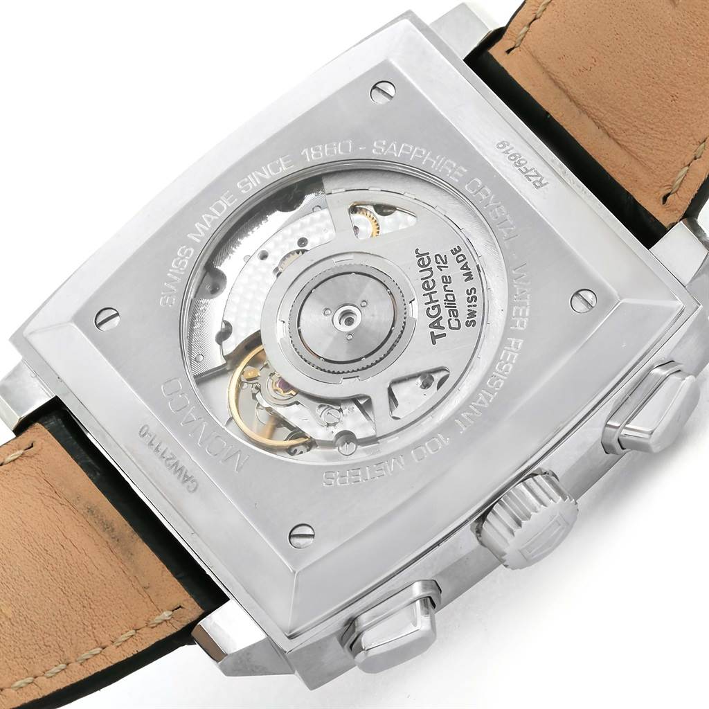 The image shows the back view of the Tag Heuer Monaco CAW2111 Men's Stainless Steel Blue Dial CAW2111 Men's Stainless Steel Blue Dial watch, showcasing the automatic movement and a leather strap.