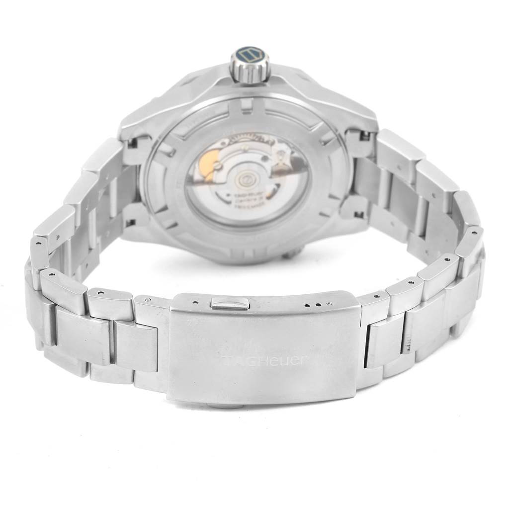 The image shows the back view of a Tag Heuer Aquaracer RWC2411 Men's Stainless Steel Blue Dial RWC2411 Men's Stainless Steel Blue Dial watch, highlighting its movement through a transparent case back and the clasp.