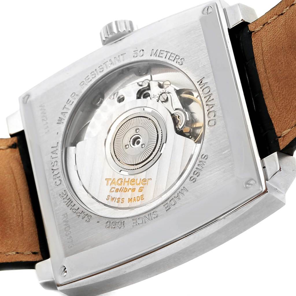 The image shows the back view of the Tag Heuer Monaco WW2111 Men's Stainless Steel Blue Dial WW2111 Men's Stainless Steel Blue Dial watch, showcasing its movement, rotor, and caseback details.