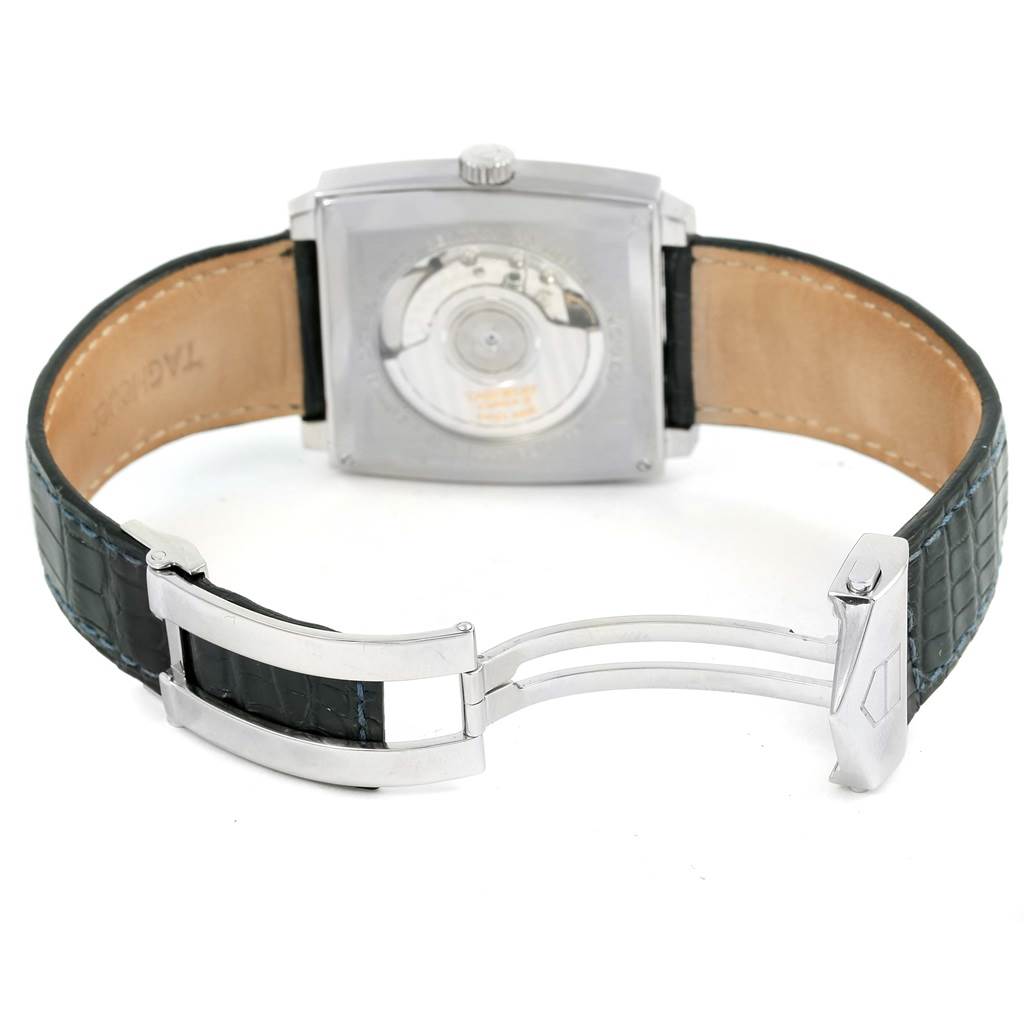 This is a rear view of the Tag Heuer Monaco WW2111 Men's Stainless Steel Blue Dial WW2111 Men's Stainless Steel Blue Dial, showing its open back case and clasp.