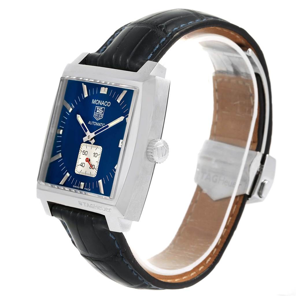 The image shows a Tag Heuer Monaco WW2111 Men's Stainless Steel Blue Dial WW2111 Men's Stainless Steel Blue Dial watch angled to the right, revealing the face, crown, and leather strap.