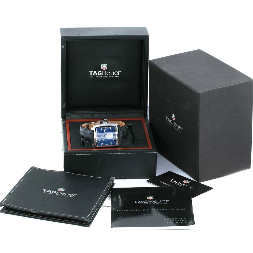 The image shows the Tag Heuer Monaco WW2111 Men's Stainless Steel Blue Dial WW2111 Men's Stainless Steel Blue Dial watch in its open box, along with the outer box, manuals, and warranty card.