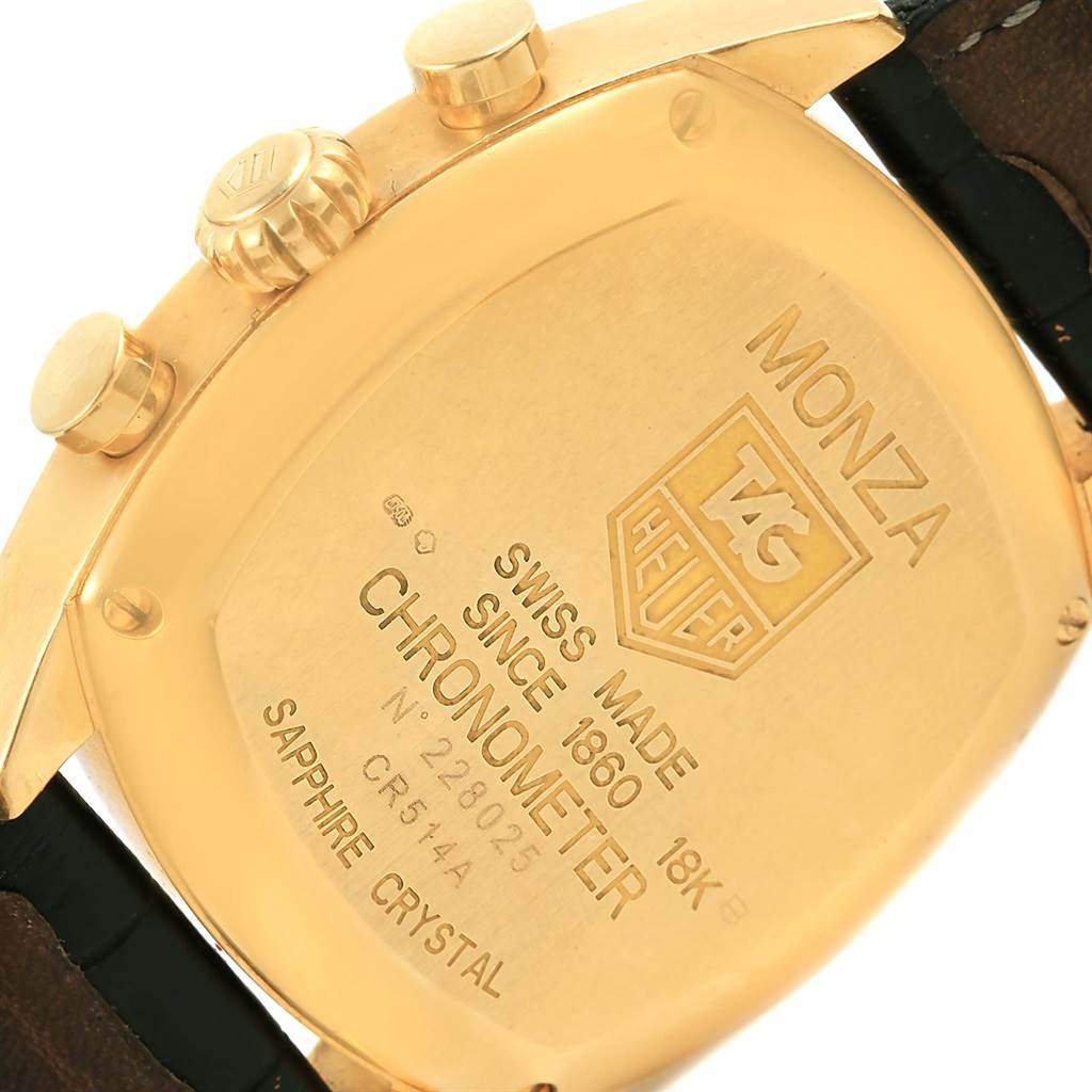 This image shows the back of the Tag Heuer Monza CR514A Men's Yellow Gold Silver Dial CR514A Men's Yellow Gold Silver Dial watch, highlighting the engravings and gold tone of the case.
