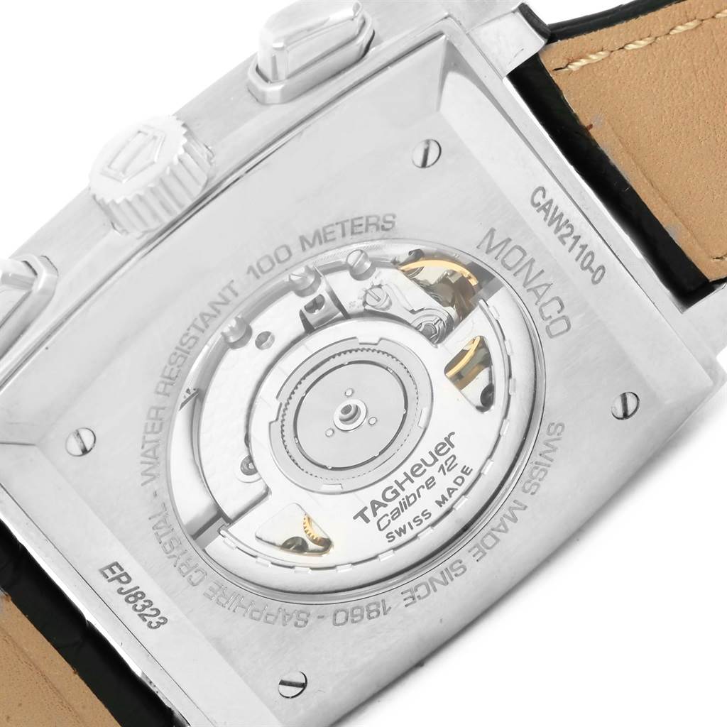 The image shows the back view of the Monaco model by Tag Heuer, highlighting the movement and the information engravings.