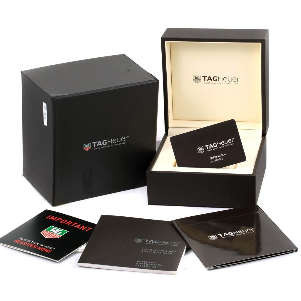 This image shows the Tag Heuer Monaco CAW2110 Men's Stainless Steel Black Dial CAW2110 Men's Stainless Steel Black Dial watch's packaging, including the box, warranty card, and instruction booklets.