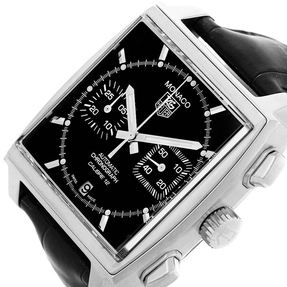 The Monaco Tag Heuer watch is shown at an oblique angle highlighting the dial, crown, and push-buttons.