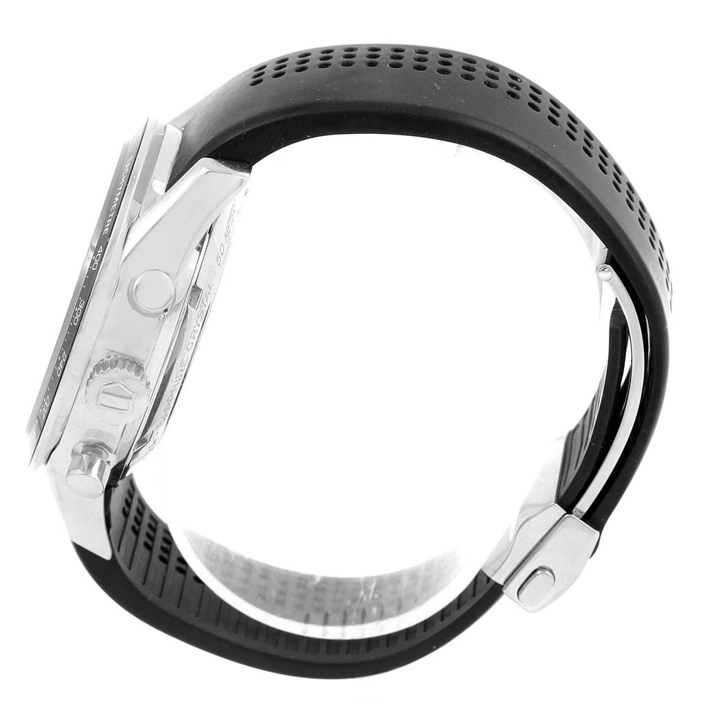 The image shows a side view of the Tag Heuer Carrera CV2014 Men's Stainless Steel Black Dial CV2014 Men's Stainless Steel Black Dial watch, highlighting the case, crown, and perforated black strap.