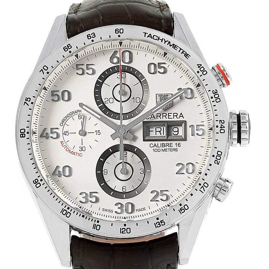 The image shows the face of a Tag Heuer Carrera watch, featuring a tachymeter scale, chronograph subdials, and a date window.