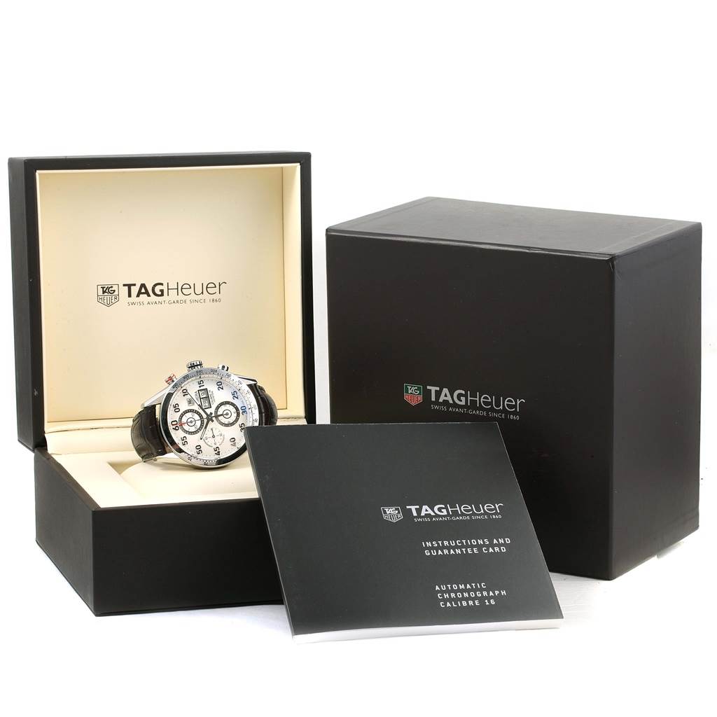 The image shows the Tag Heuer Carrera CV2A11 Men's Stainless Steel Silver Dial CV2A11 Men's Stainless Steel Silver Dial watch displayed in its open box, accompanied by the outer box and instruction manual.