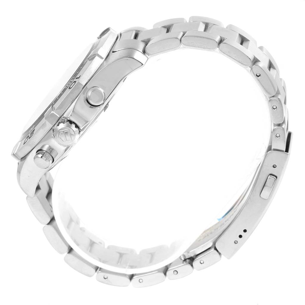 The image shows a side view of a Tag Heuer Aquaracer CAF101D.BA0821 Men's Stainless Steel Yellow Dial CAF101D.BA0821 Men's Stainless Steel Yellow Dial watch, highlighting its crown, pushers, and metal bracelet.