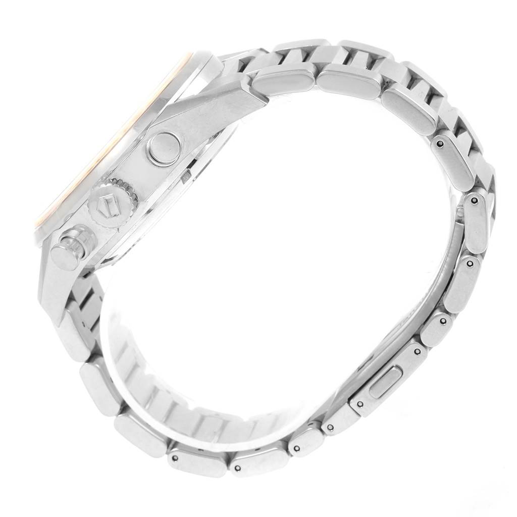 The image shows a side view of a Tag Heuer Carrera CAR2012.BA0796 Men's Stainless Steel Silver Dial CAR2012.BA0796 Men's Stainless Steel Silver Dial watch, highlighting the crown, pushers, and metallic bracelet.