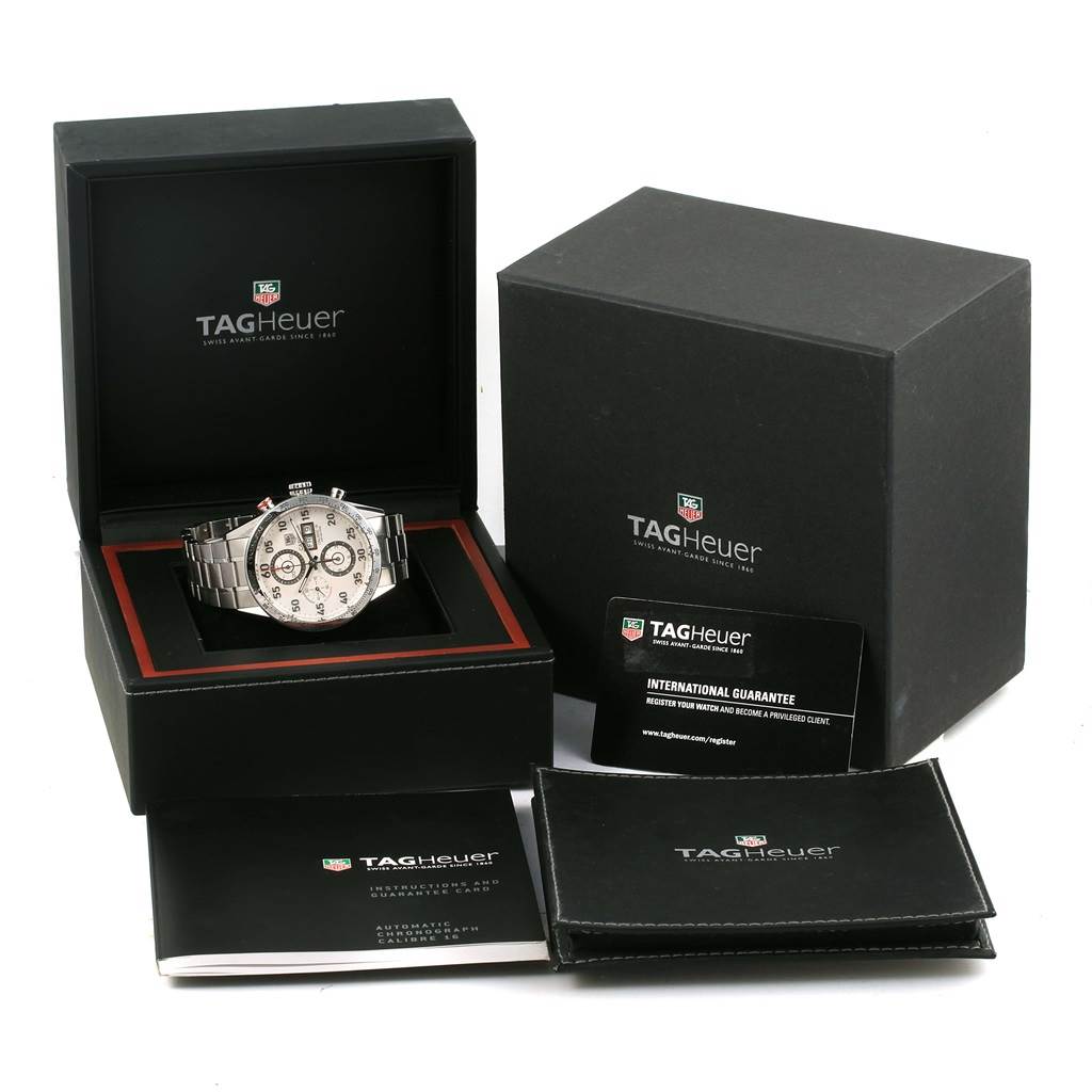 The image shows a Tag Heuer Carrera CV2A11.BA0796 Men's Stainless Steel Silver Dial CV2A11.BA0796 Men's Stainless Steel Silver Dial watch from a front angle, inside its box, with accompanying manuals and guarantee card.