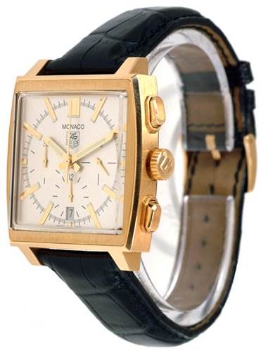 The image shows a Tag Heuer Monaco CW5140 Men's Yellow Gold Silver Dial CW5140 Men's Yellow Gold Silver Dial watch at a slight angle, highlighting its square face, gold casing, black leather strap, and side buttons.