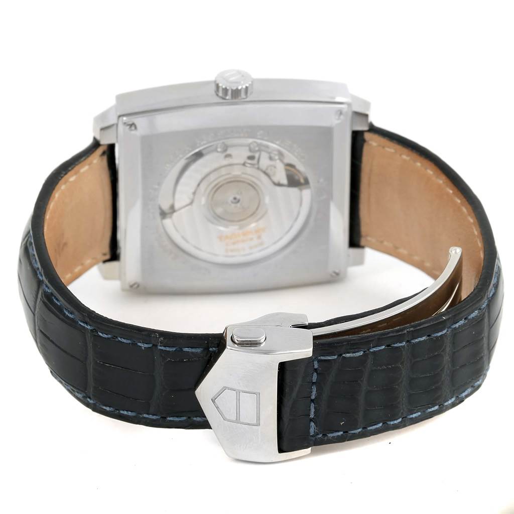 The image shows the back view of a Tag Heuer Monaco WW2111 Men's Stainless Steel Blue Dial WW2111 Men's Stainless Steel Blue Dial watch, displaying its transparent case back and black leather strap with a clasp.