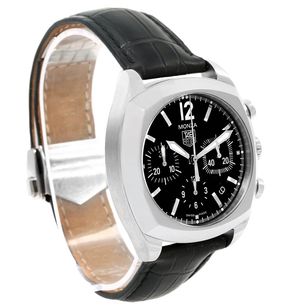 The image shows a Tag Heuer Monza CR2113.FC6164 Men's Stainless Steel Black Dial CR2113.FC6164 Men's Stainless Steel Black Dial watch at a slight angle, highlighting its black dial, chronograph, and black leather strap.