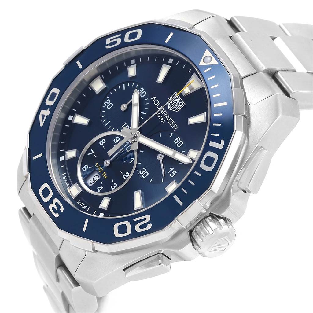 The image shows a close-up, angled view of a Tag Heuer Aquaracer CAY111B.BA0927 Men's Stainless Steel Blue Dial CAY111B.BA0927 Men's Stainless Steel Blue Dial watch, highlighting its face, bezel, and part of the bracelet.