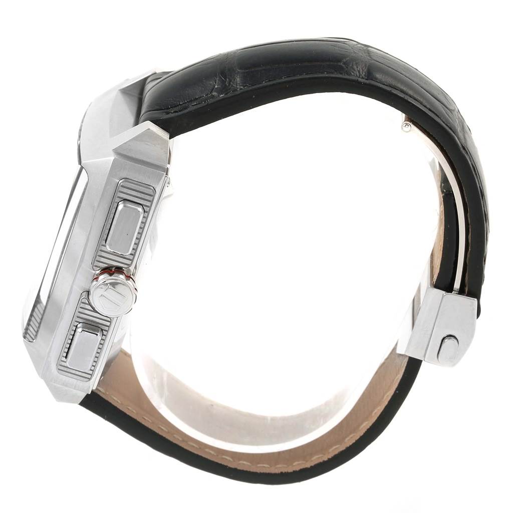 The image shows a side view of a Tag Heuer Monaco CAL2110.FC6257 Men's Stainless Steel Black Dial CAL2110.FC6257 Men's Stainless Steel Black Dial watch, highlighting its crown, pushers, and black leather strap.