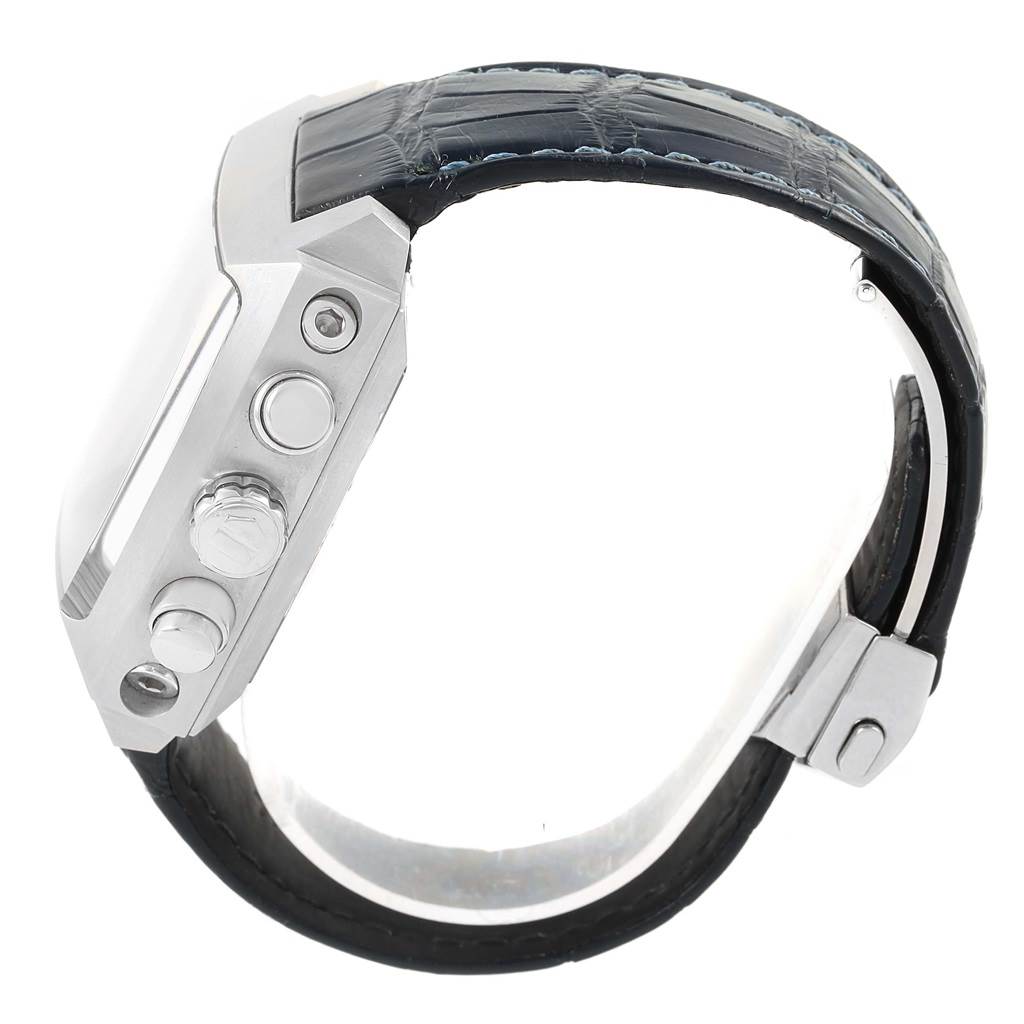 The image shows a side view of the Tag Heuer Monaco CAL5111.FC6299 Men's Stainless Steel Blue Dial CAL5111.FC6299 Men's Stainless Steel Blue Dial watch, highlighting its case, pushers, crown, and part of the leather strap.