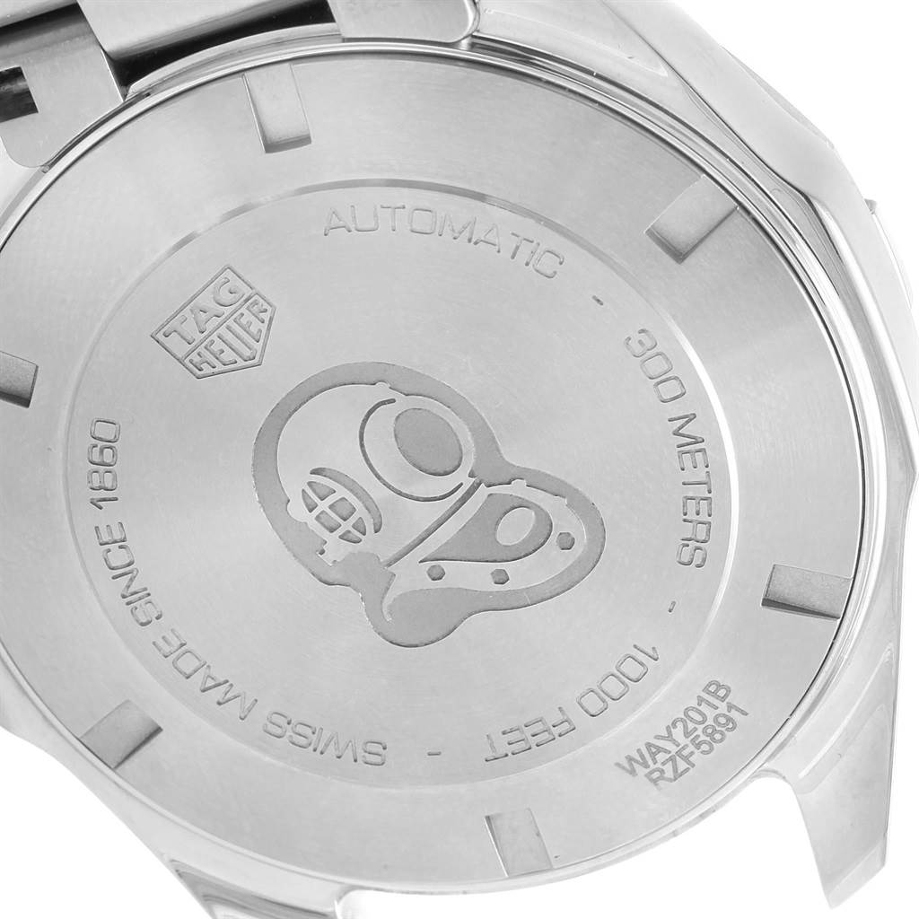 The image shows the stainless steel case back of a Tag Heuer Aquaracer WAY201B Men's Stainless Steel Blue Dial WAY201B Men's Stainless Steel Blue Dial watch featuring an engraved diving helmet and text detailing its specifications.