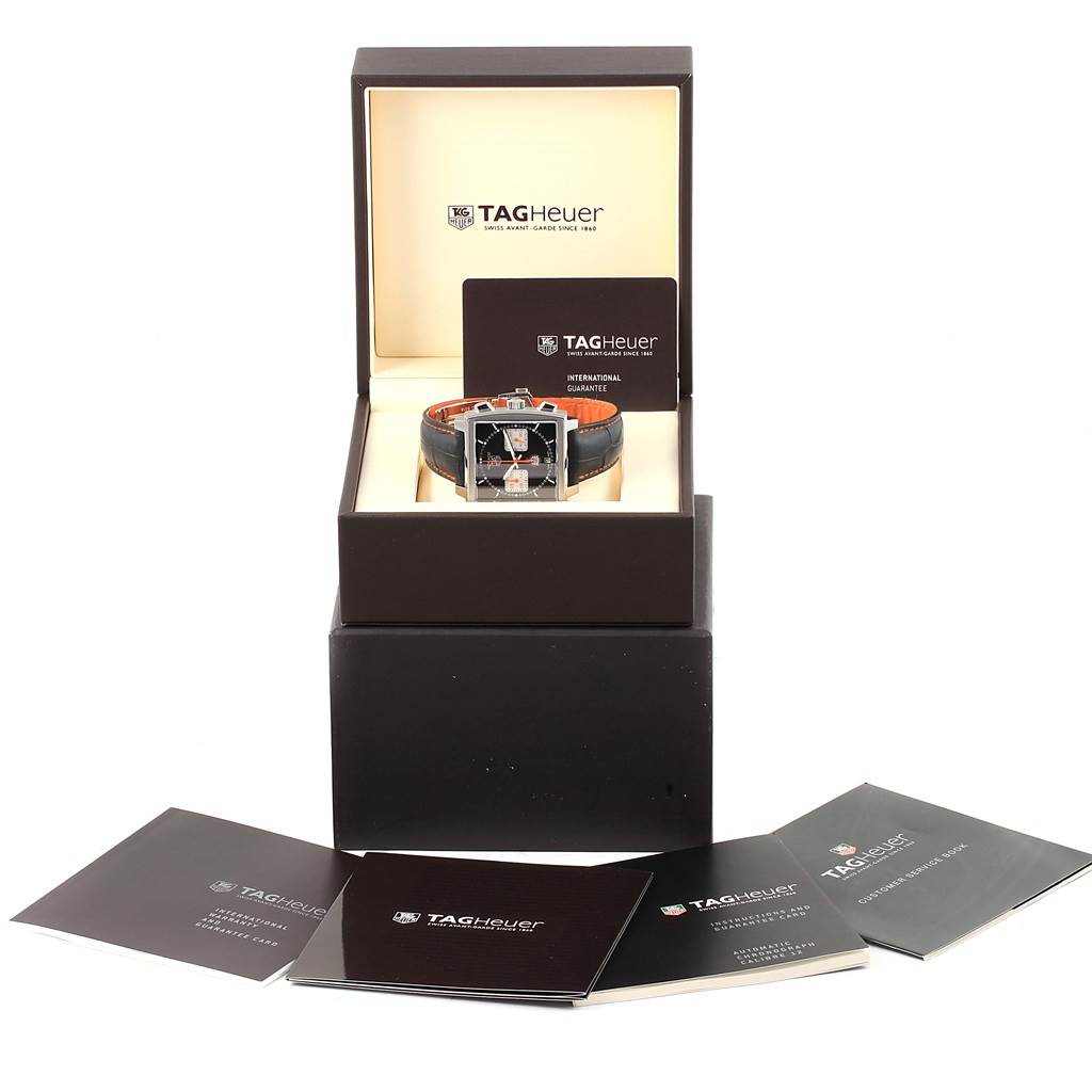 The Tag Heuer Limited Edition CAW211K.FC6311 Men's Stainless Steel Black Dial CAW211K.FC6311 Men's Stainless Steel Black Dial model is shown front-on, displayed in its box with accompanying booklets.