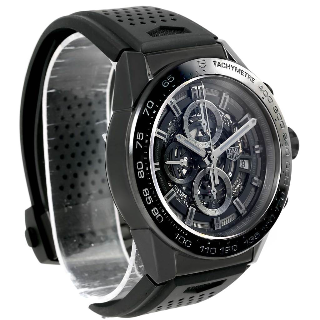 The image shows a side and front angle of a Tag Heuer Carrera CAR2A90.FT6071 Men
s Stainless Steel Black Dial CAR2A90.FT6071 Men
s Stainless Steel Black Dial watch, highlighting its black casing and tachymeter bezel.