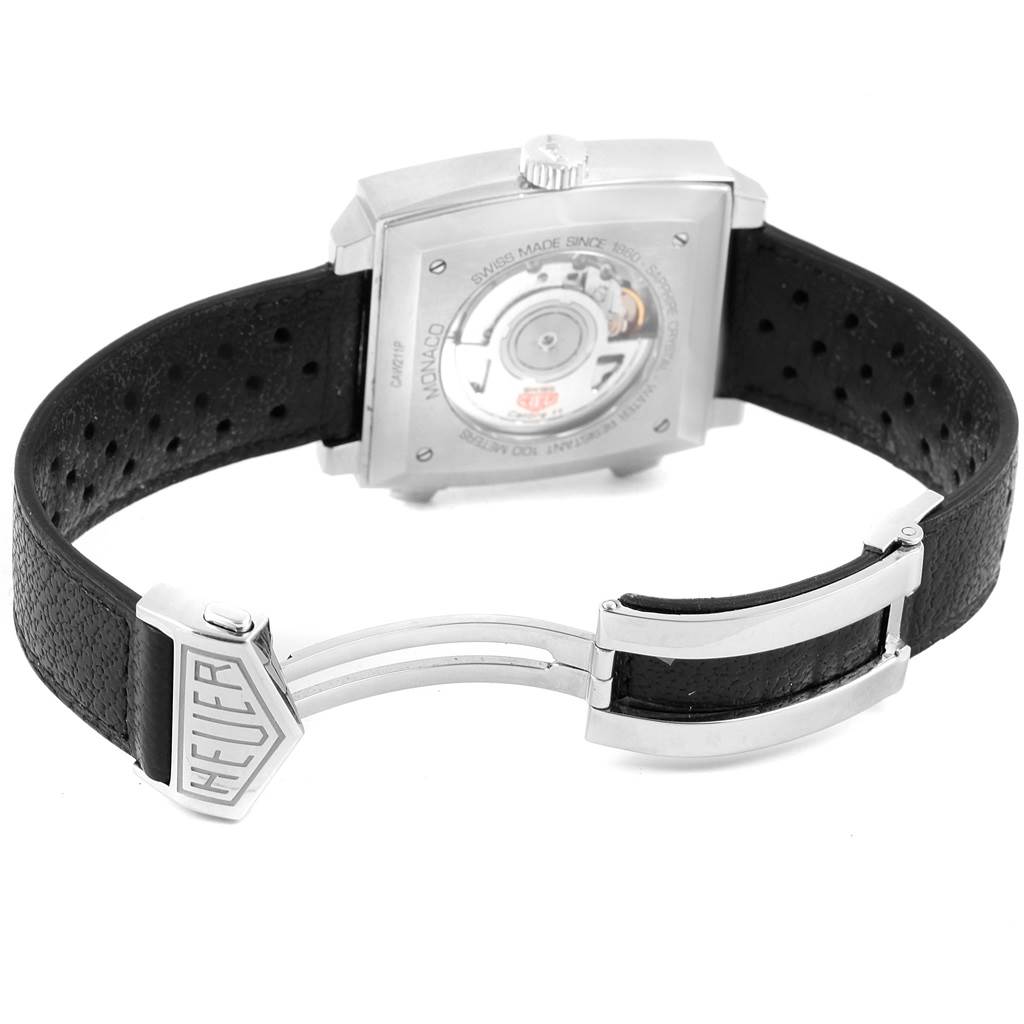 The image shows the back view of a Tag Heuer Monaco CAW211P Men's Stainless Steel Blue Dial CAW211P Men's Stainless Steel Blue Dial watch, featuring its case back and black leather strap with a Heuer-branded clasp.