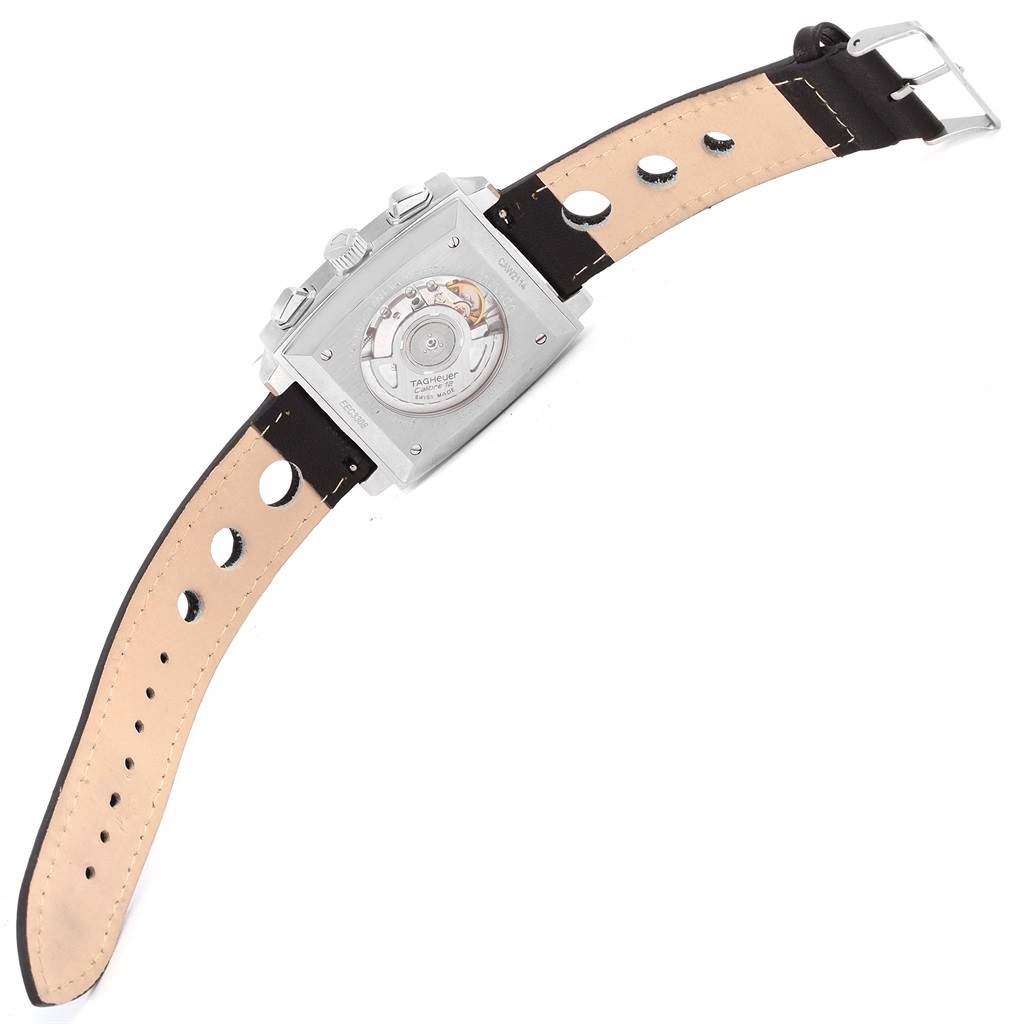 The image shows the back view of a Tag Heuer Monaco CAW2114 Men's Stainless Steel Black Dial CAW2114 Men's Stainless Steel Black Dial watch, highlighting its open case back and leather strap.