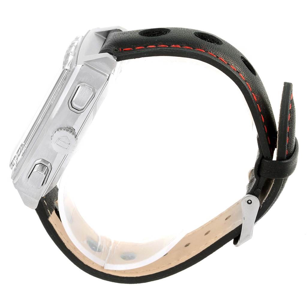 The image shows a side view of a Tag Heuer Monaco CAW2114 Men's Stainless Steel Black Dial CAW2114 Men's Stainless Steel Black Dial watch, highlighting its buttons, crown, and black leather strap with red stitching.