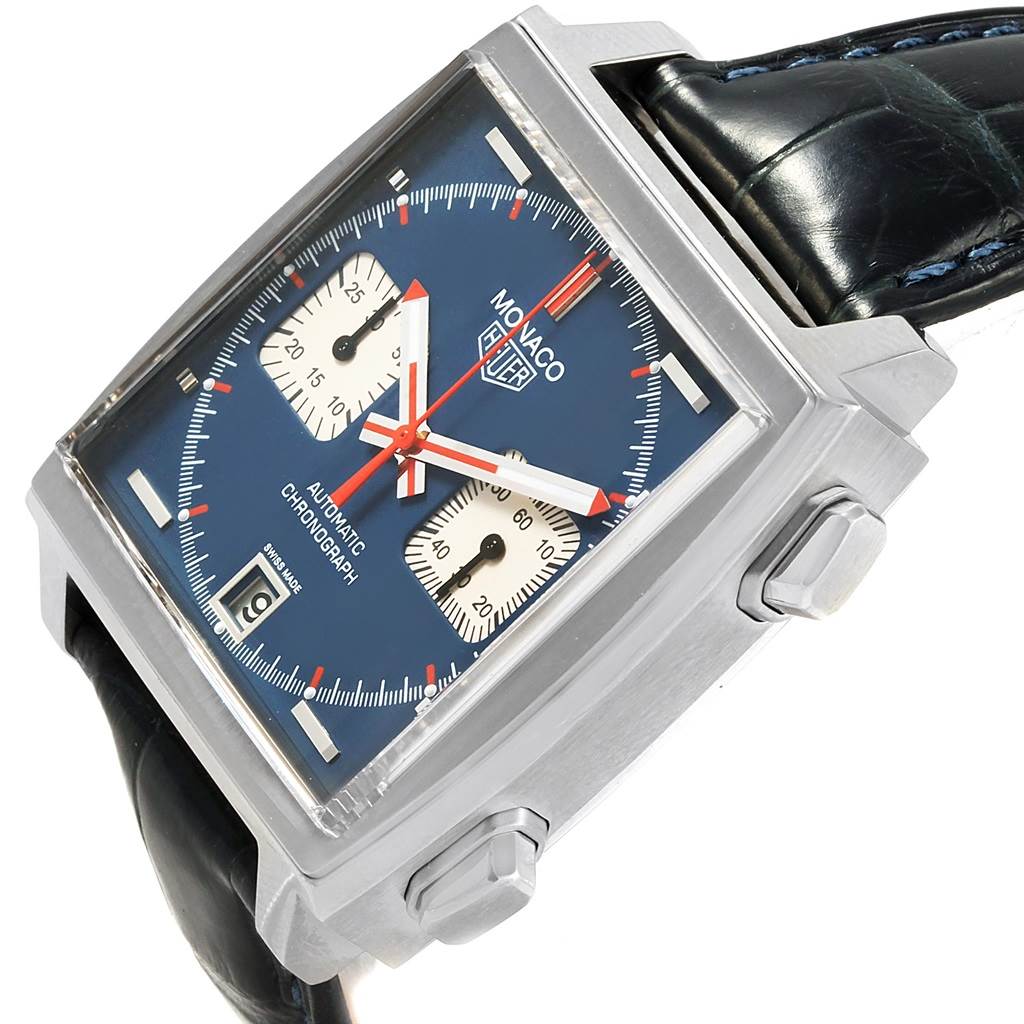 The image shows a Tag Heuer Monaco CAW211A.EB0026 Men's Stainless Steel Blue Dial CAW211A.EB0026 Men's Stainless Steel Blue Dial watch at a slight angle, displaying the face, crown, and chronograph pushers.