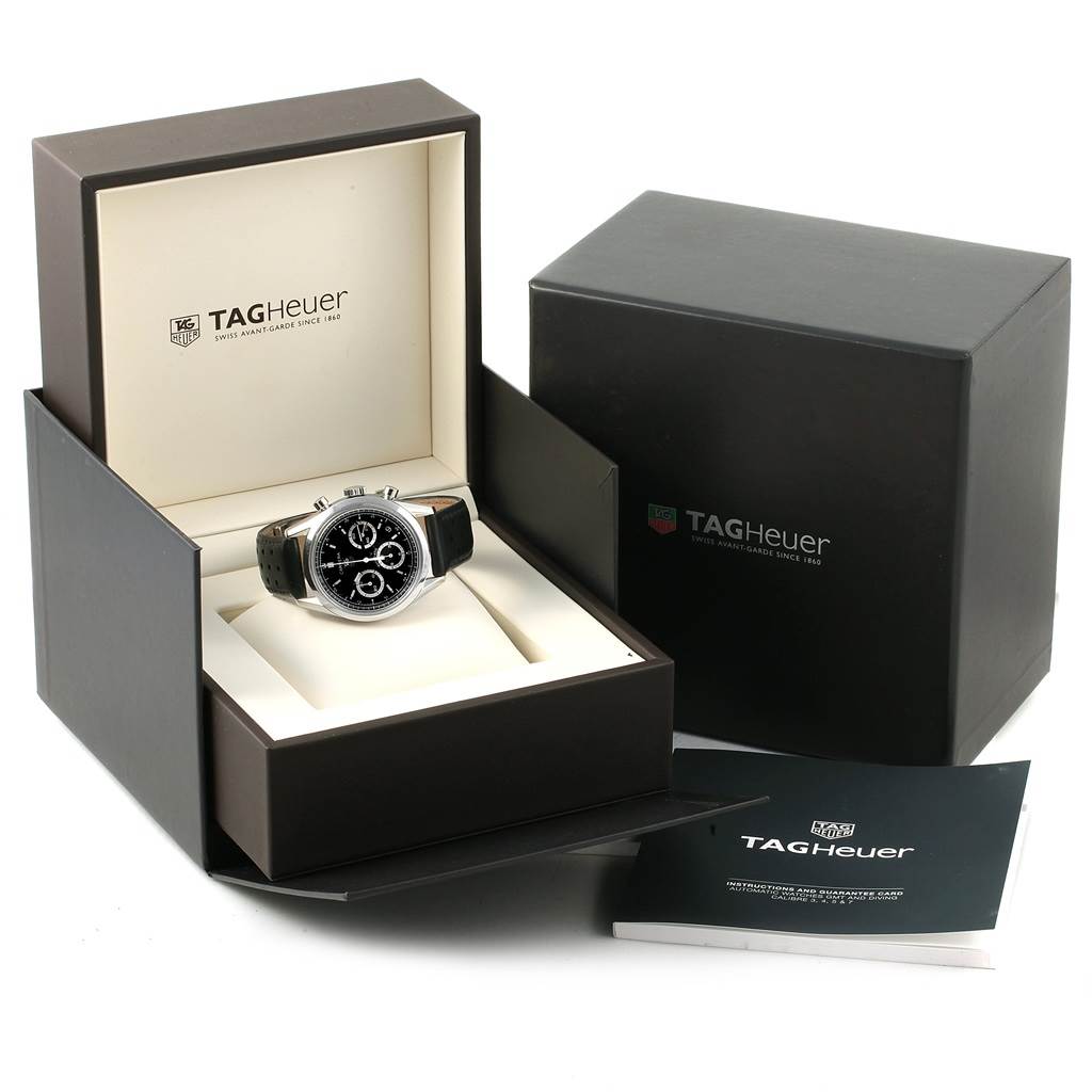 The image shows a Tag Heuer Carrera CV2113.FC6180 Men
s Stainless Steel Black Dial CV2113.FC6180 Men
s Stainless Steel Black Dial model watch in its opened box, along with an additional booklet and packaging box.