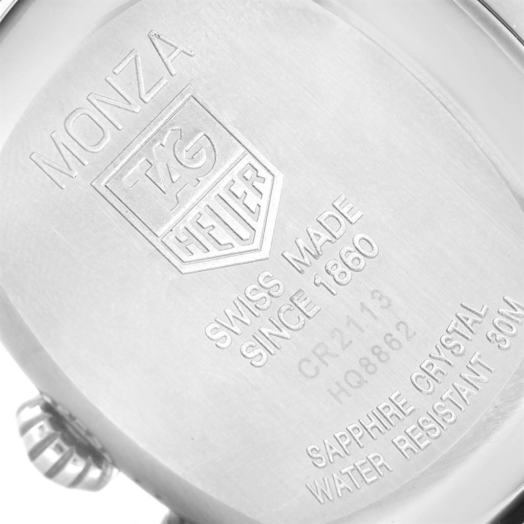 The image shows the back case of a Tag Heuer Monza CR2113.FC6164 Men's Stainless Steel Black Dial CR2113.FC6164 Men's Stainless Steel Black Dial watch, highlighting the engravings and crown at an angle.
