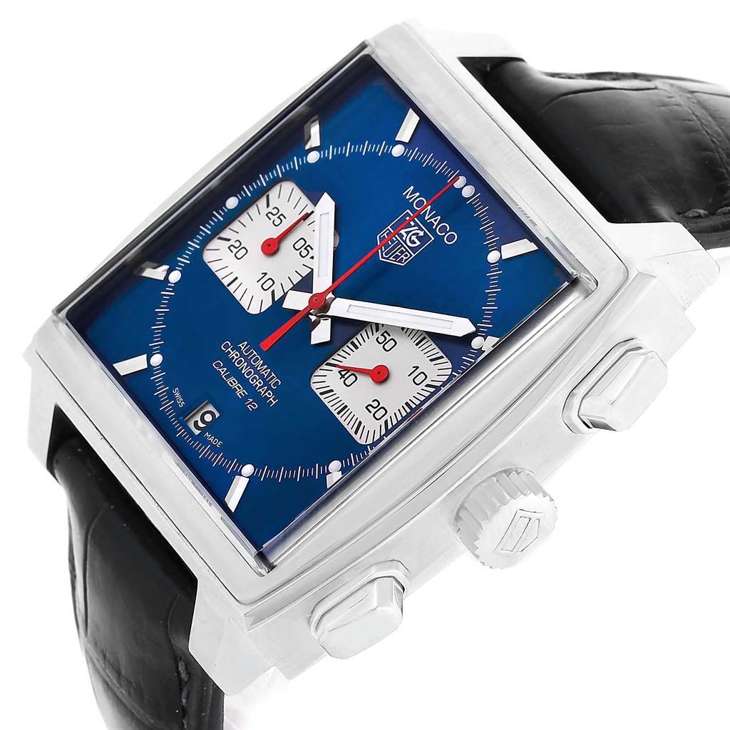 This Tag Heuer Monaco CAW2111 Men's Stainless Steel Blue Dial CAW2111 Men's Stainless Steel Blue Dial watch is shown at an angle highlighting the face, crown, pushers, and part of the black leather strap.