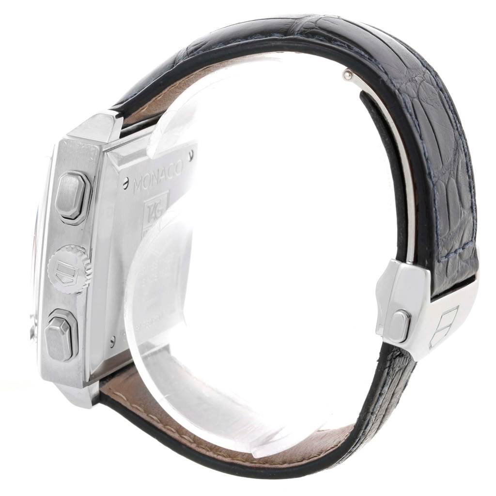 The image shows a side angle of the Tag Heuer Monaco TAG HEUER Men's Stainless Steel Blue Dial TAG HEUER Men's Stainless Steel Blue Dial watch, highlighting the crown, pushers, and leather strap.
