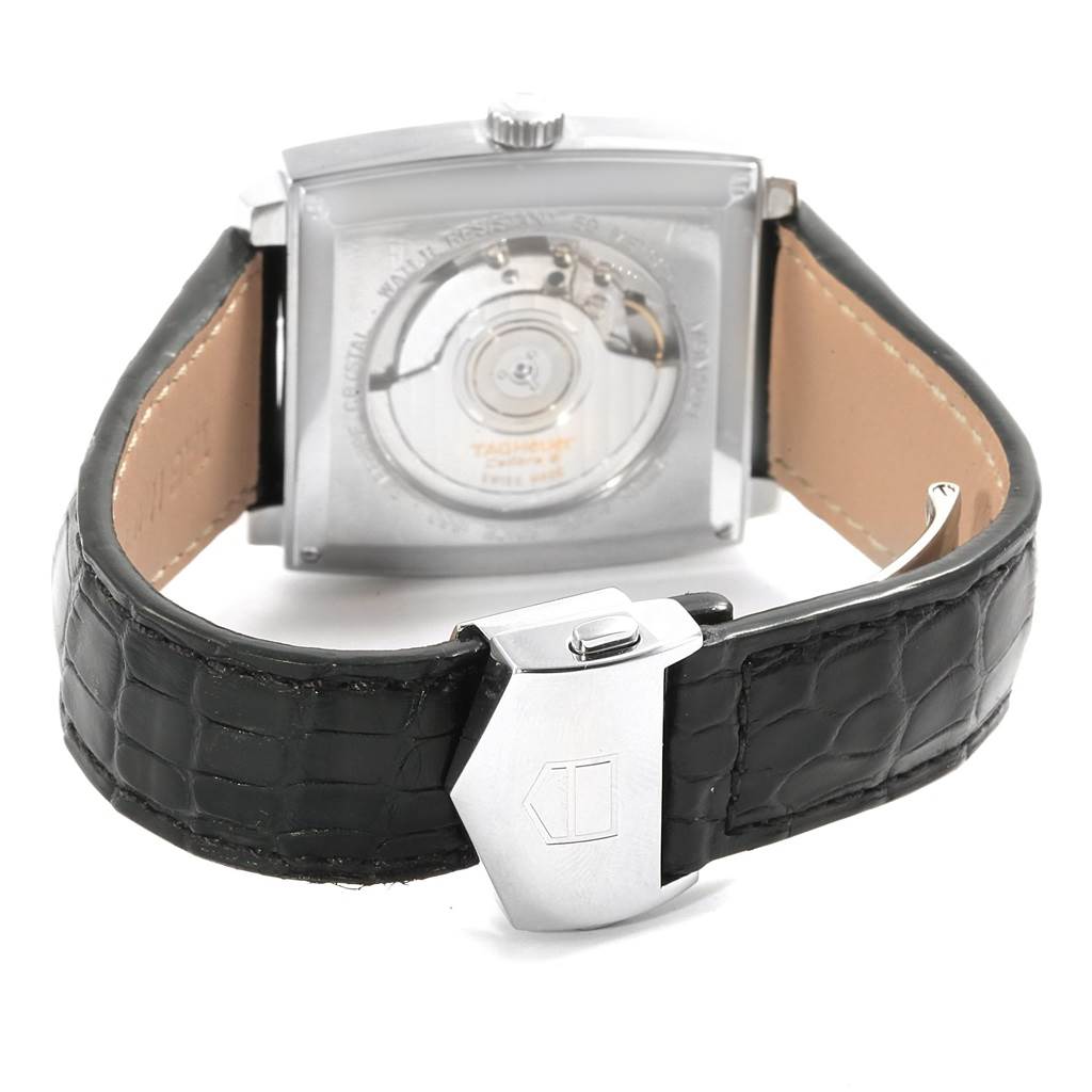 The image shows the back view of the Tag Heuer Monaco WW2110 Men's Stainless Steel Black Dial WW2110 Men's Stainless Steel Black Dial watch, highlighting the clasp and movement.