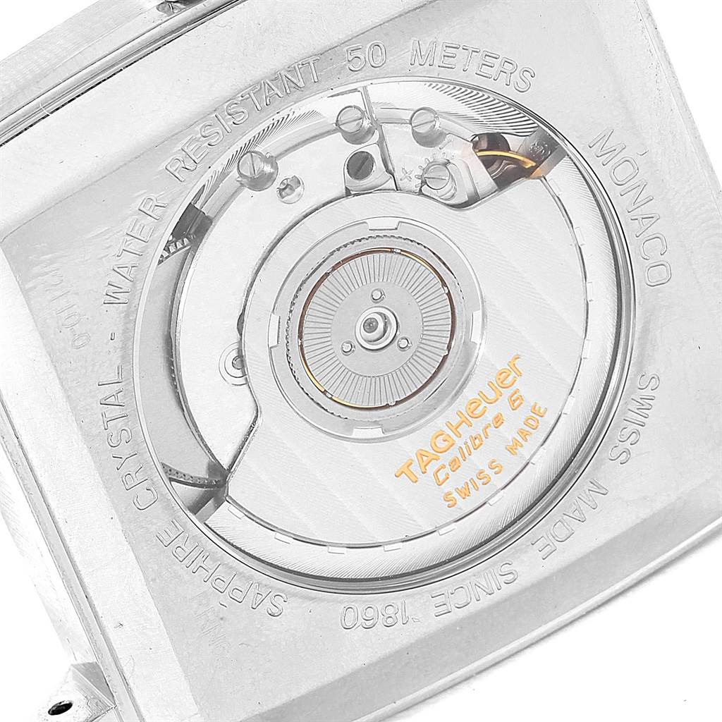 A close-up view of the Tag Heuer Monaco WW2110 Men's Stainless Steel Black Dial WW2110 Men's Stainless Steel Black Dial watch case back, showing the movement and engravings.