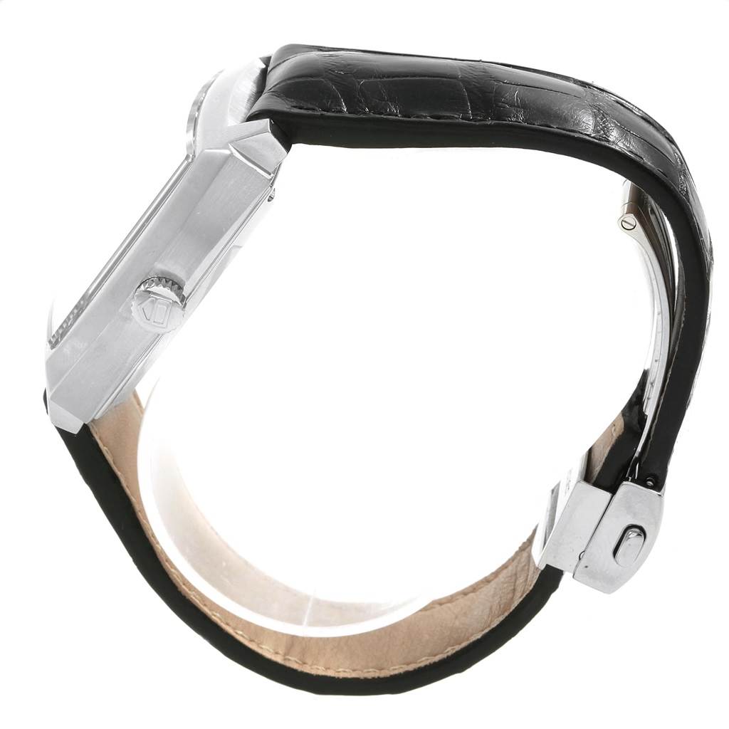 The image shows a side view of the Tag Heuer Monaco WW2110 Men's Stainless Steel Black Dial WW2110 Men's Stainless Steel Black Dial watch, highlighting its crown, case, and leather strap.