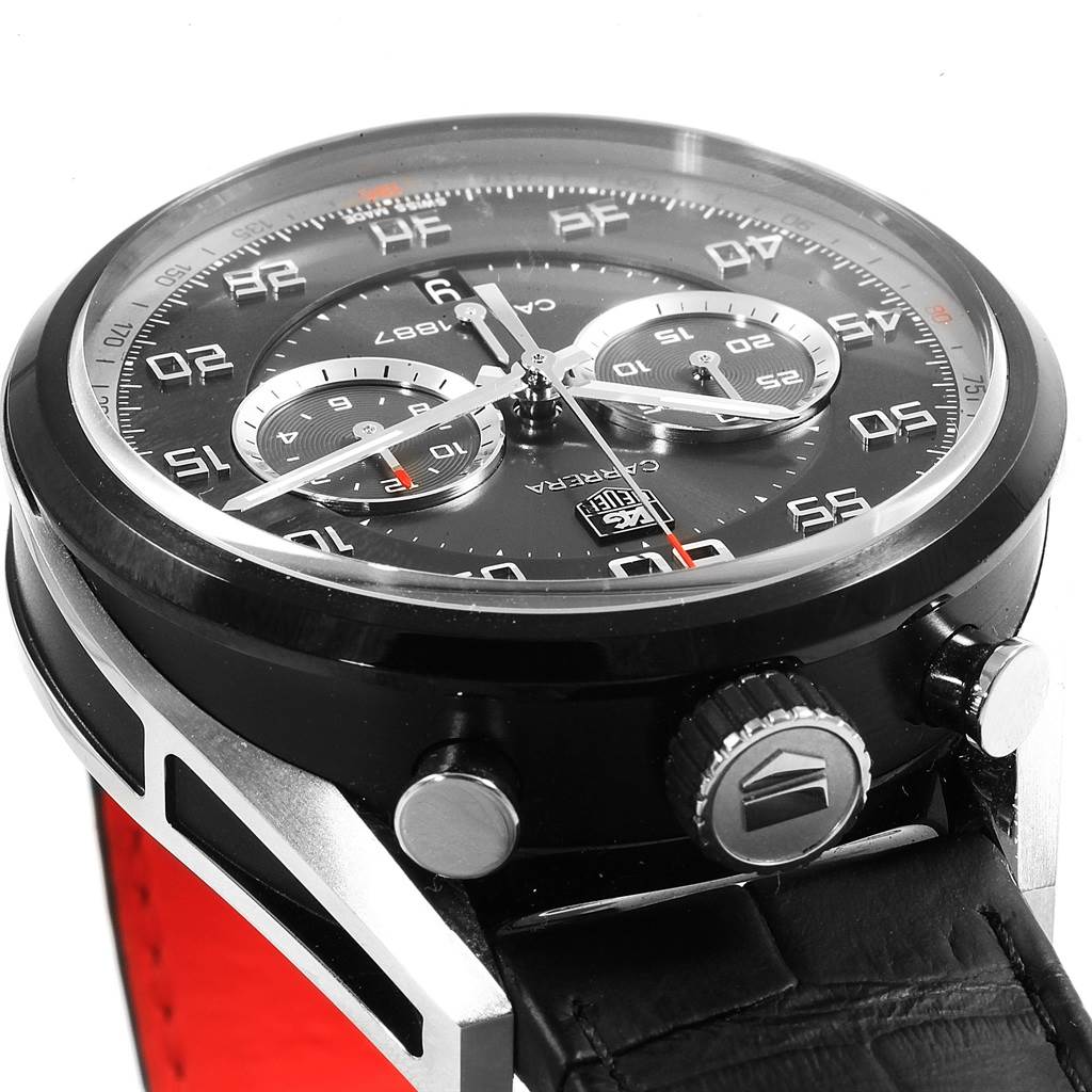 The image shows the face and side buttons of a Tag Heuer Carrera CAR2C12.FC6327 Men
s Titanium Black Dial CAR2C12.FC6327 Men
s Titanium Black Dial watch from a side angle.