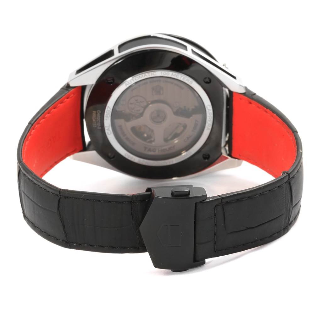 The image shows the back view of a Tag Heuer Carrera CAR2C12.FC6327 Men
s Titanium Black Dial CAR2C12.FC6327 Men
s Titanium Black Dial watch, highlighting the case back and the black strap with a buckle.