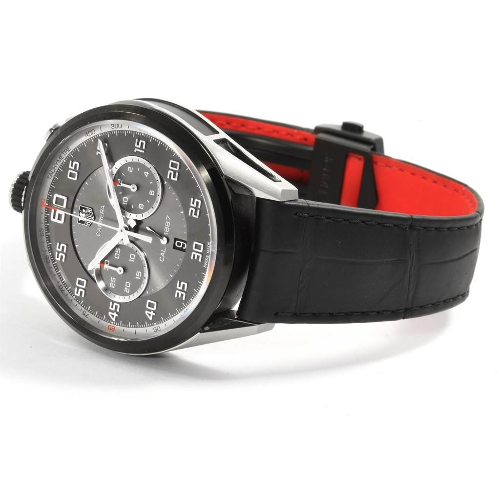 The image shows a side angle of the Tag Heuer Carrera CAR2C12.FC6327 Men
s Titanium Black Dial CAR2C12.FC6327 Men
s Titanium Black Dial watch, displaying its dial, bezel, and black leather strap.