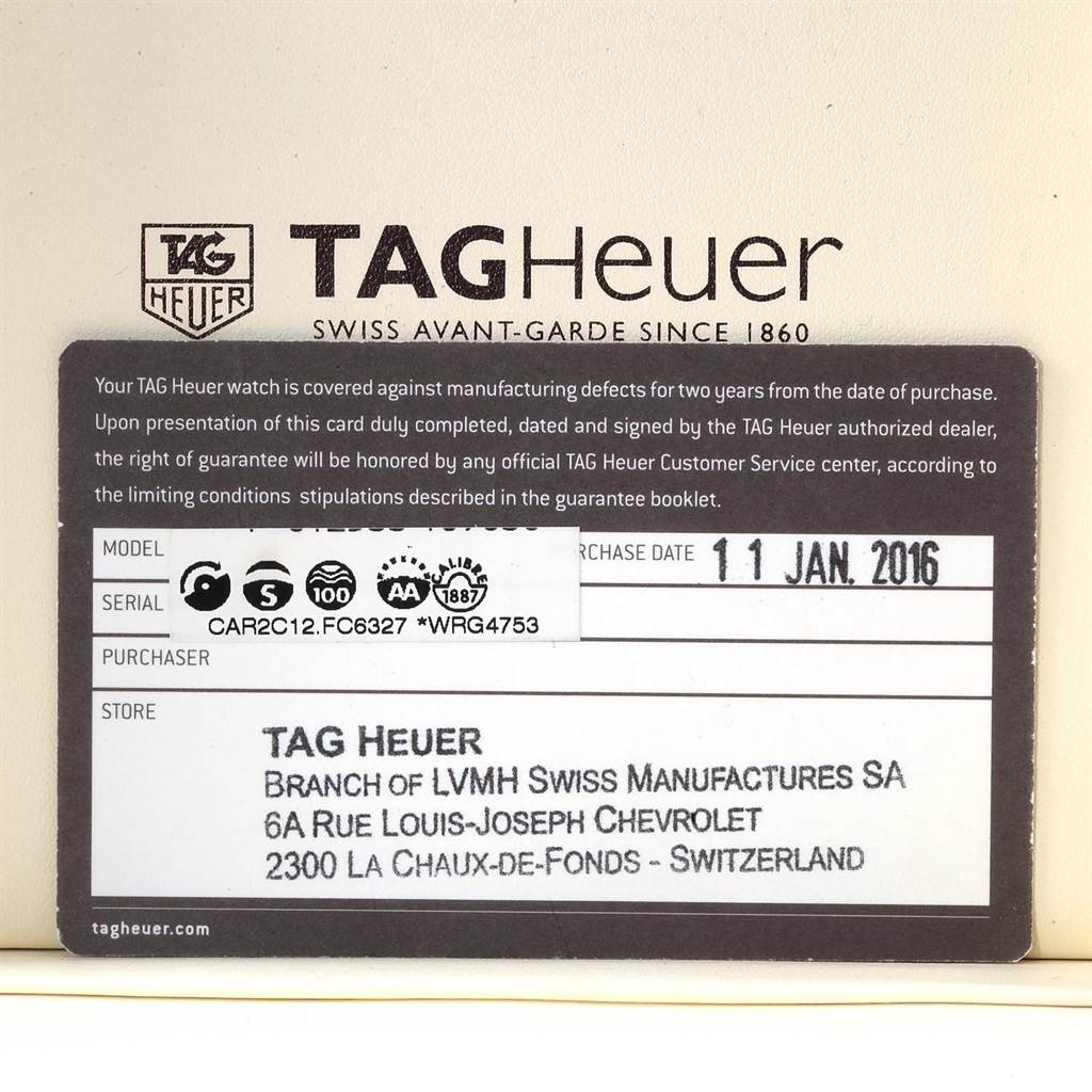 This image shows the warranty card for a Tag Heuer Carrera CAR2C12.FC6327 Men
s Titanium Black Dial CAR2C12.FC6327 Men
s Titanium Black Dial model watch, indicating its purchase date and serial number.